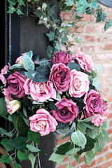 Blooming pink bouquet roses decorated the doorway at a wedding for bridal floral and valentine day