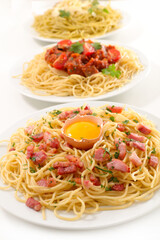 plate of spashetti with different sauce, carbonara, tomato sauce or pesto sauce