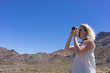 Woman sight seeing with binoculars 