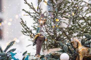 Beautiful festive decorations on the Christmas tree. Close-up. Beautiful Christmas background. The concept of decorations and decor for the new year. New Year's Card 2025