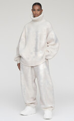 Fototapeta premium Full-Length Shot of Female Model in Oversized Beige Outfit