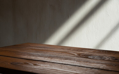 background for overlaying products. Close-up of a round empty oak table with sunlight and tropical plant leaves. Organic beauty, natural concept. Layout, podium, spa, sunscreen.
