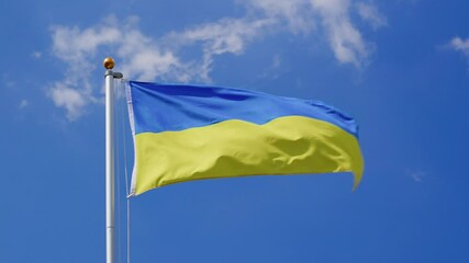 Waving Ukraine flag flying on a flagpole, slow motion, close up, low angle