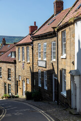Robin Hoods Bay institute and cottages on steep street Yorkshire UK