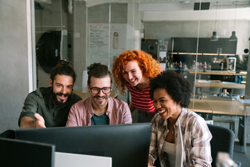 Group of business people and software developers working as a team in office