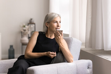 Mature woman hold smartphone, record audio message, leave voicemail by work or personal, chatting...