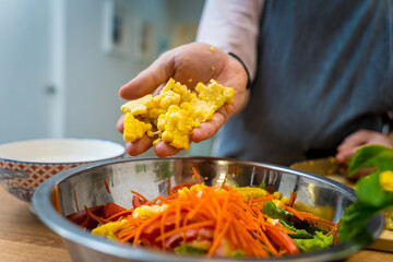 Chef at the kitchen preparing spicy glass noodle salad