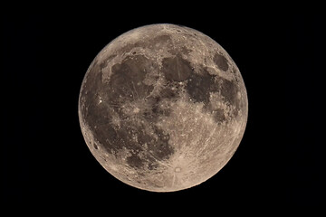 An original horizontal photograph of the super blue moon with dark night background - full moon as...