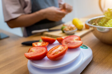 Chef at the kitchen preparing spicy glass noodle salad