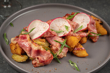 Portion of german salad with potato radish and bacon