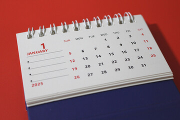 Monthly calendar template for the new year 2025 desk calendar,on red background.