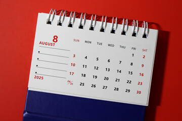 Monthly calendar template for the new year 2025 desk calendar,on red background.