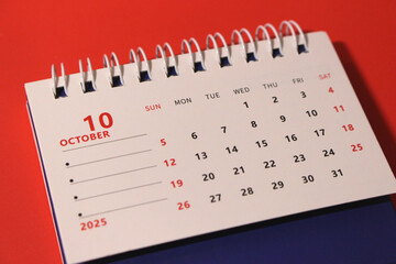 Monthly calendar template for the new year 2025 desk calendar,on red background.