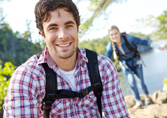 Happy man, portrait or couple hiking in forest for travel, outdoor adventure or journey in woods. Mountain, hikers or people in nature together on holiday vacation, lake trip or break to explore park