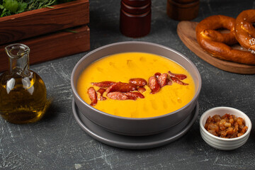 Portion of German pea soup with smoked sausages