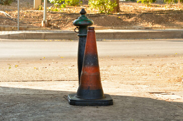 Urban Street Scene with Weathered Traffic Cone and Old Fire Hydrant