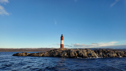 Ushuaia Lighthouse At Ushuaia In Tierra Del Fuego Argentina. Amazing Bay Water. Maritime Excursion. Boat Sailing Scene. Ushuaia Lighthouse At Ushuaia In Tierra Del Fuego Argentina.