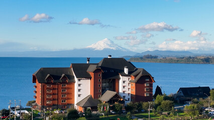 Osorno Volcano At Osorno In Los Lagos Chile. Volcano Landscape. Sky Clouds Background. Los Lagos Chile. Snow Capped Mountain. Osorno Volcano At Osorno In Los Lagos Chile.