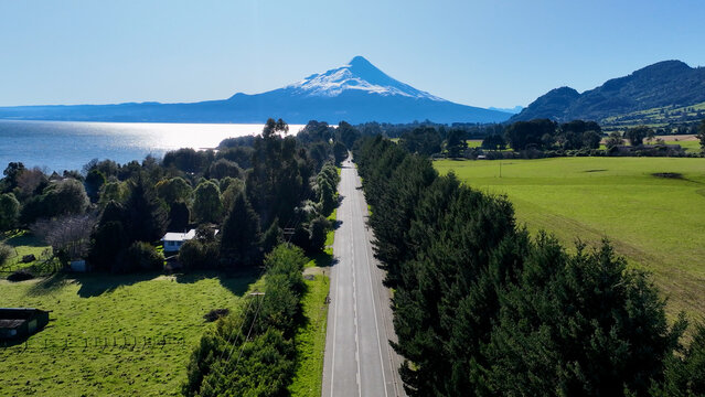 Patagonia Road At Puerto Octay In Los Lagos Chile. Volcano Landscape. Sky Clouds Background. Los Lagos Chile. Road Trip Mountain. Patagonia Road At Puerto Octay In Los Lagos Chile.