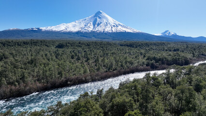 Fototapeta premium Volcan Osorno At Puerto Varas In Los Lagos Chile. Volcano Landscape. Sky Clouds Background. Los Lagos Chile. Snowcapped Mountain. Volcan Osorno At Puerto Varas In Los Lagos Chile.