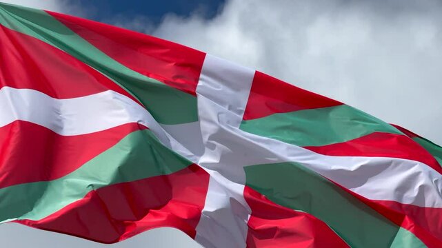 Basque Country flag waving over blue sky. Flag of the Basques, region of Spain. Pais Vasco