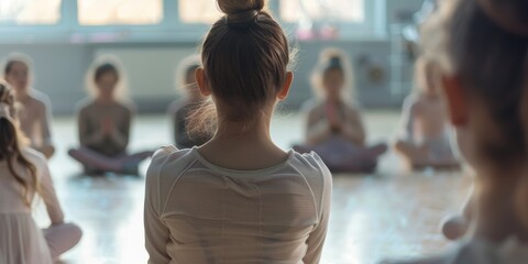 Dance instructor addressing students at an art studio, guiding them in creative exercises while others relax on the floor