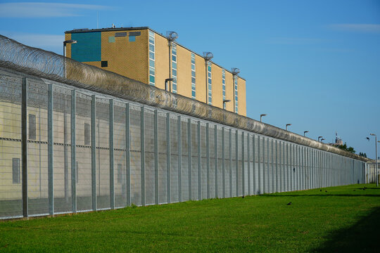 High security fence with spiky Nato wire rolls on top at a German prison in Hanover, Lower Saxony, Germany. Barbed wire to stop prisoners from escaping.