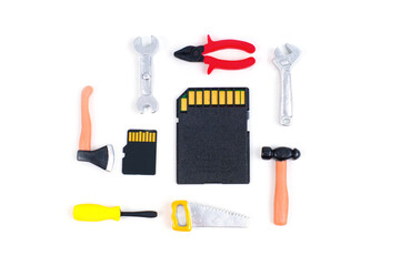 Miniature Hand Tools And Memory Cards For Data Recovery Concept