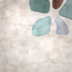 stylish textured old paper background with sea glass pebble pieces 
