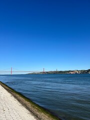 Suspension bridge crossing the river Tagus in Lisbon Portugal. The 25 de Abril Bridge. 