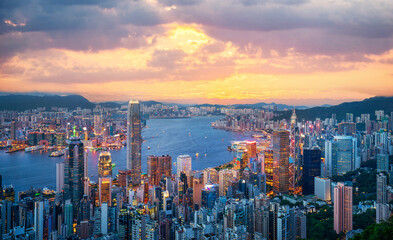 Fototapeta premium Aerial view of skyscrapers at dusk over the financial district in central Hong Kong, China. Asia tourist attraction. City skyline. Traffic and transportation.