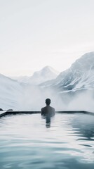 Relaxing in a serene hot spring overlooking majestic snow-capped mountains at sunrise
