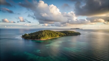 Obraz premium An Aerial View of a Lush Green Island in a Calm, Blue Ocean