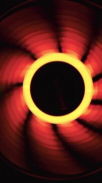 An integral part of a computer, a spinning fan. Close up of cooling system of a modern computer.