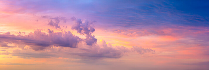 Sunrise sundown sky with gentle colorful clouds without birds. Real sky. Panoramic. Large size photo.