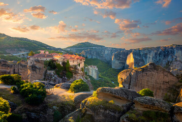 Meteora. Greece, Meteora Monasteries. Panoramic view of the Holy Monastery of Varlaam, located on the edge of a high cliff. Beautiful sunrise.  Greece, Europe