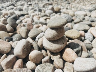 Stones piled up on the Mediterranean beach.