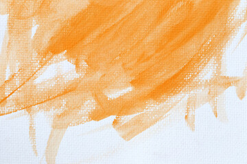 Orange watercolour paint brush on the white art paper background.