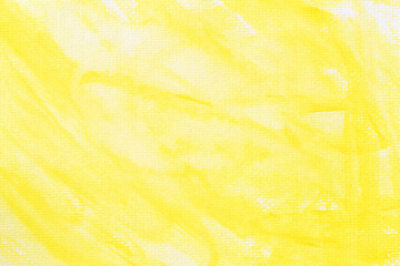 Yellow watercolour paint brush on the white art paper background.