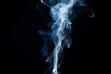 Fototapeta premium Smoke from flames or fog clouds graphic design art isolated on dark black background.