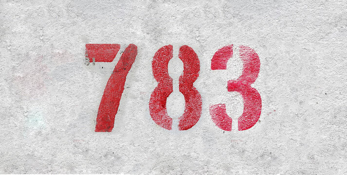 Red Number 783 on the white wall. Spray paint.
