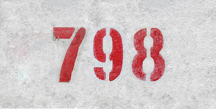 Red Number 798 on the white wall. Spray paint.