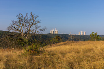 Dukovany nuclear power plant in the Czech Republic, Europe. Smoke cooling towers. There are clouds...