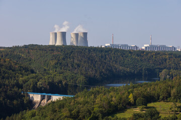 Dukovany nuclear power plant in the Czech Republic, Europe. Smoke cooling towers. There are clouds...