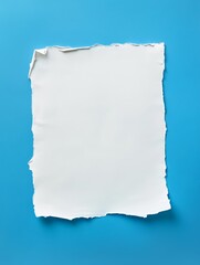 Obraz premium A torn piece of paper with a blue background
