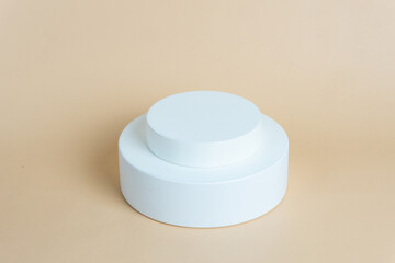 White podium on cream background color. Podium for displaying product presentation