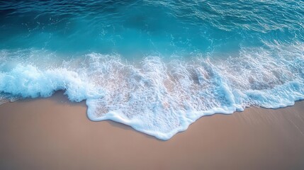 aerial view of turquoise waves crashing on pristine white sand beach mesmerizing patterns of foam and water create abstract natural art
