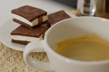 Cozy Coffee Moment with Chocolate Bars on a Light Background