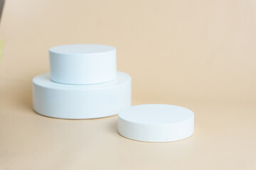 White podium on cream background color. Podium for displaying product presentation