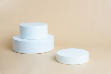 White podium on cream background color. Podium for displaying product presentation
